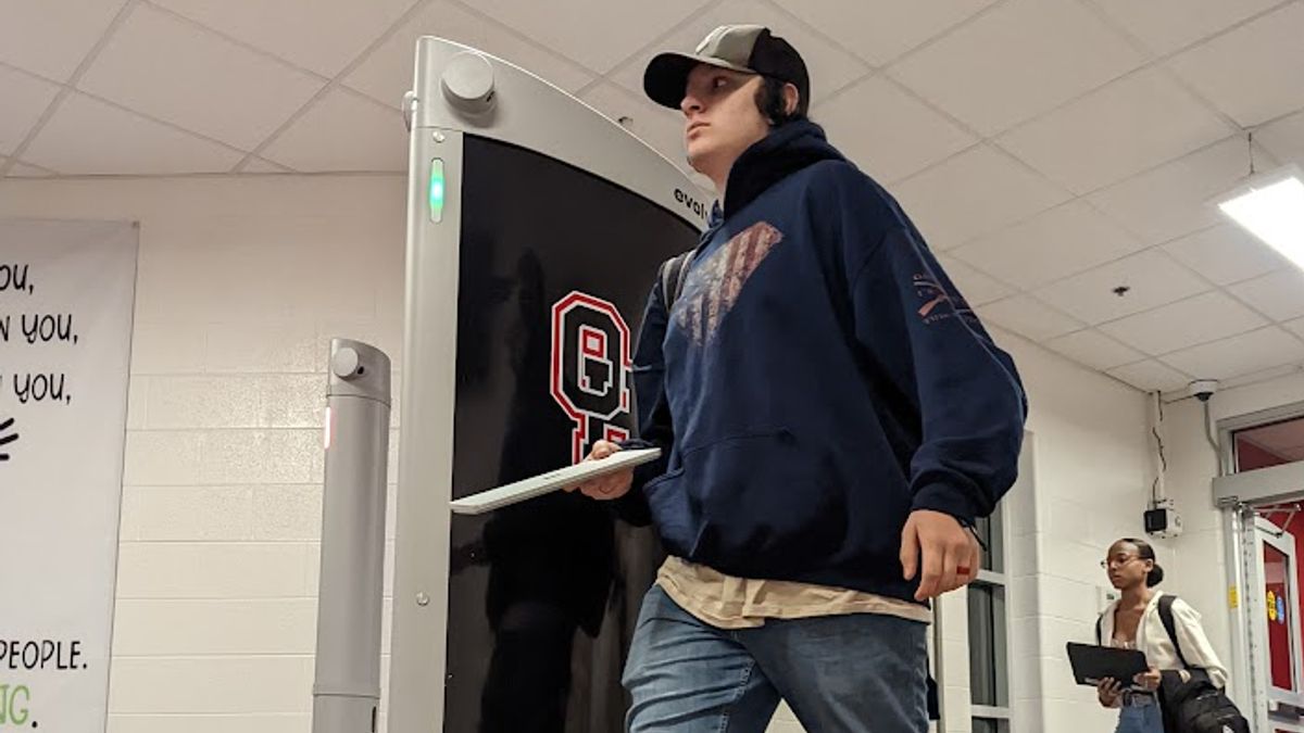 Students walk through an AI gun detection monitoring system at Fayetteville High School in Georgia.