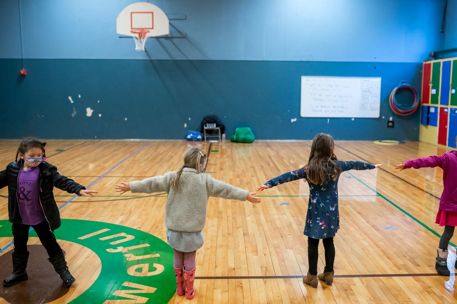 First grade students at the Green Mountain School practice social distancing during recesses in Woodland, Washington.