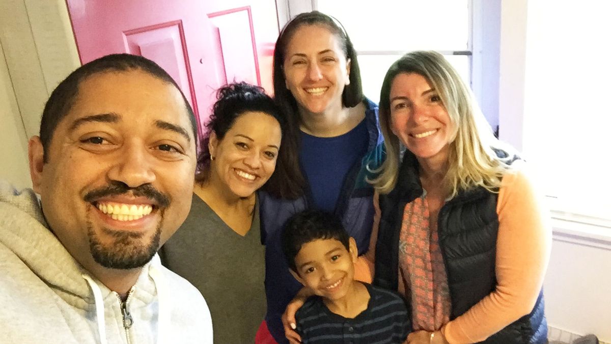 Educators from Framingham Public Schools in Massachusetts visit a family in April 2017